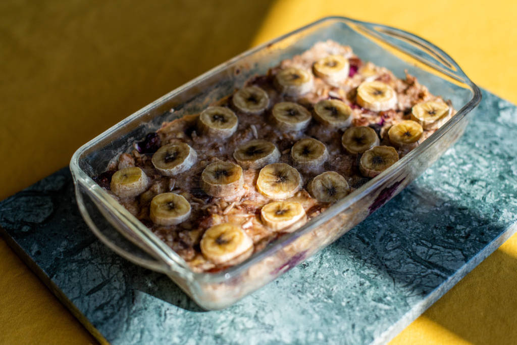 baked oatmeal with banana, blueberries, walnut and raisins.