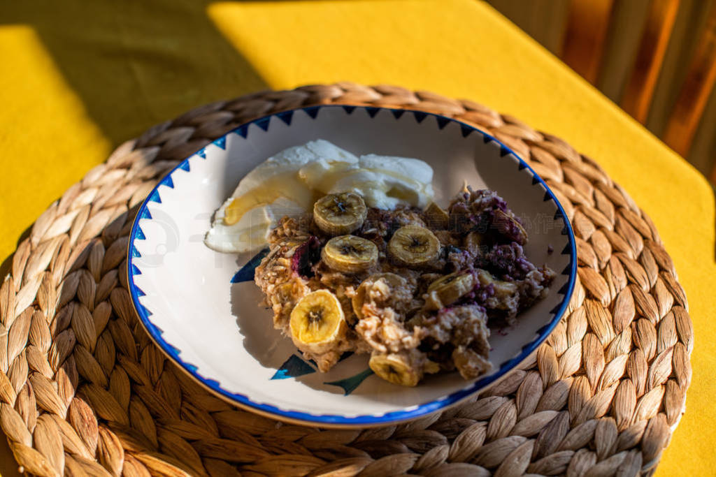 baked oatmeal with banana, blueberries, walnut and raisins.