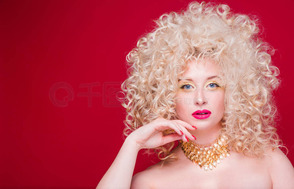 Beautiful fashionable blonde girl in retro style with voluminous