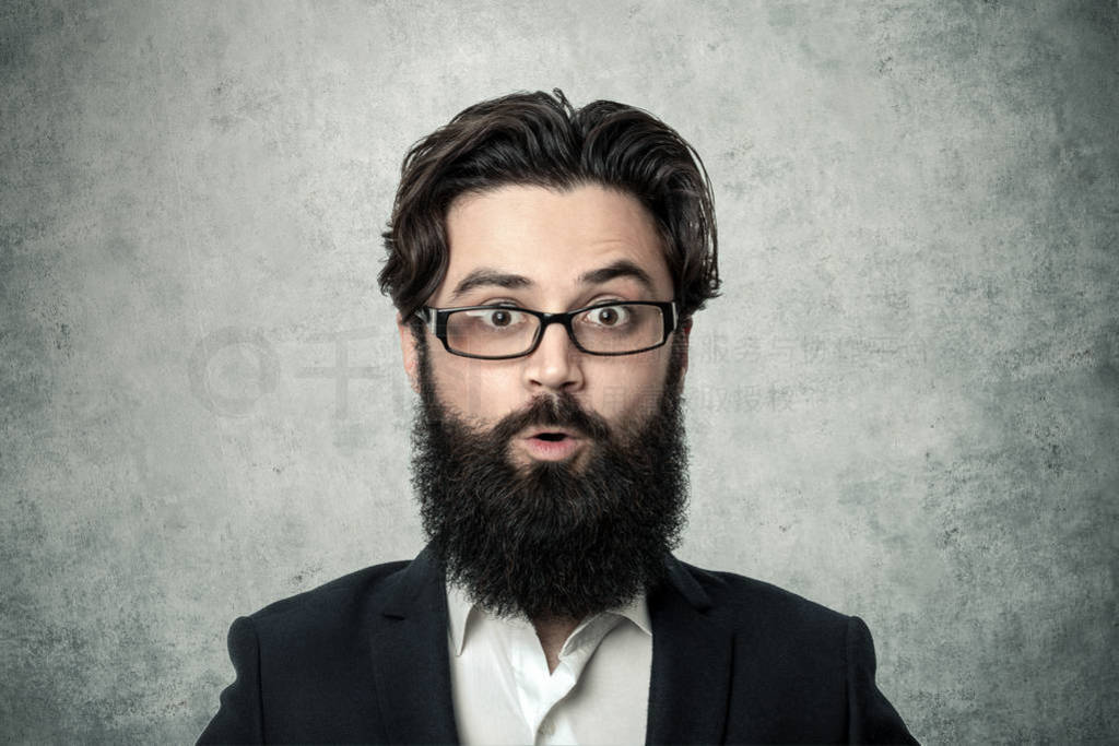 Surprised bearded businessman