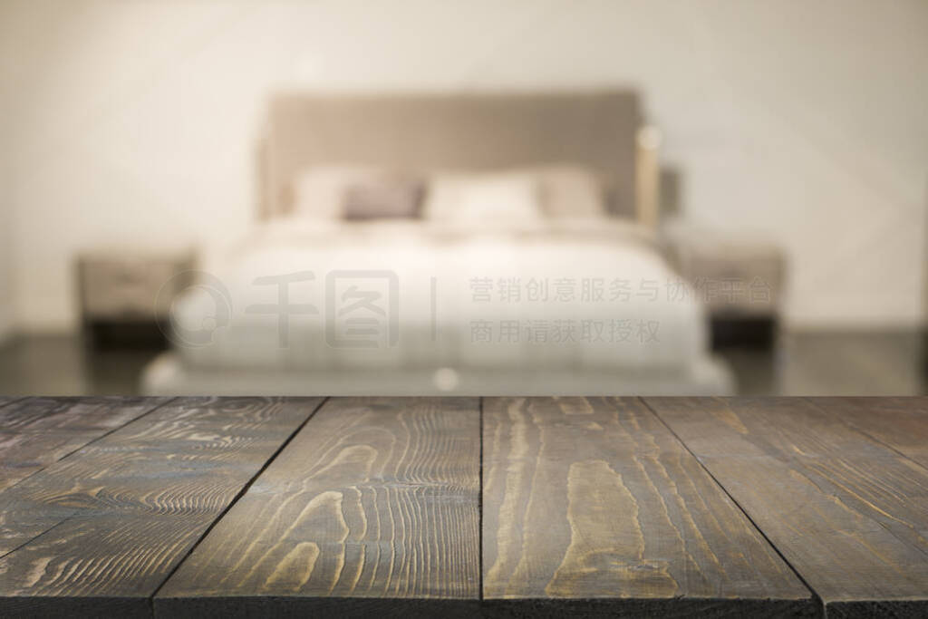Empty wooden board and blurred modern bedroom with house interio