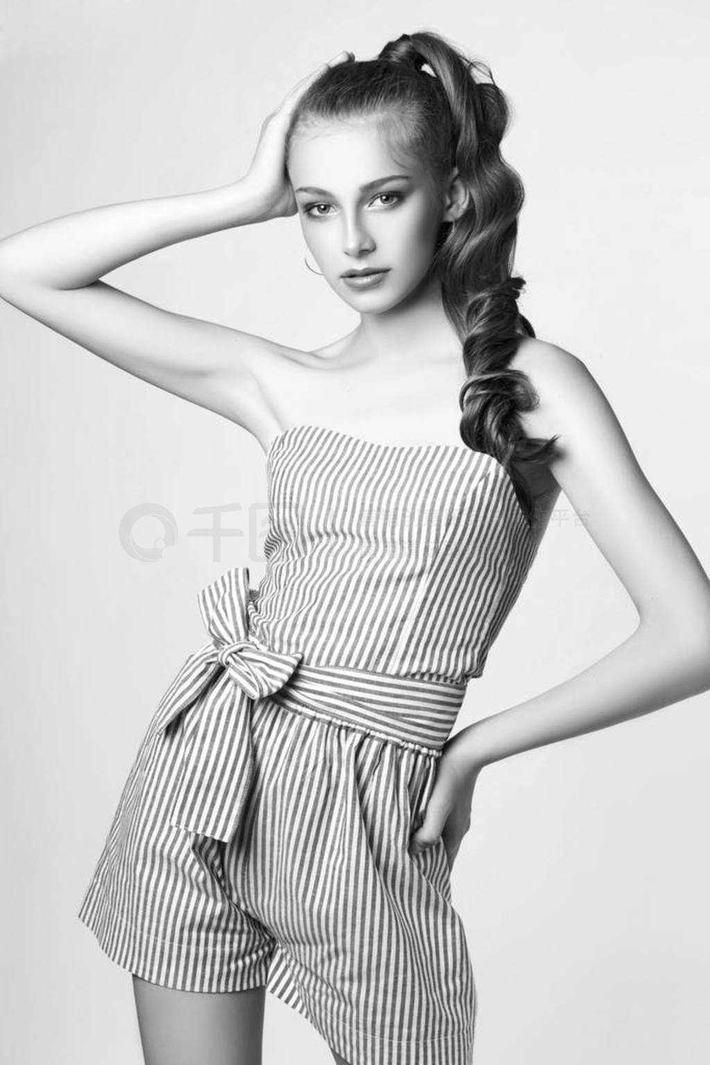 teen girl posing in studio on white background. Black and white