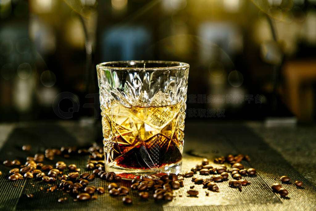 black Russian cocktail. The bartender prepares it in a glass of