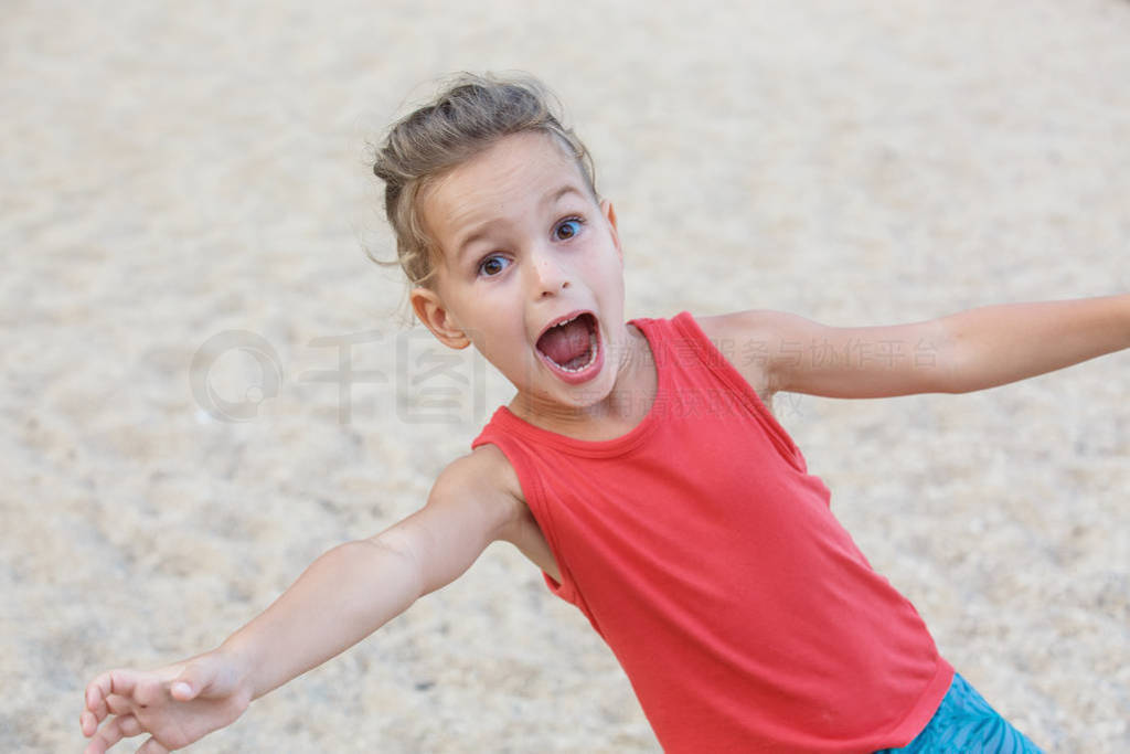 beautiful baby boy is having fun on the beach