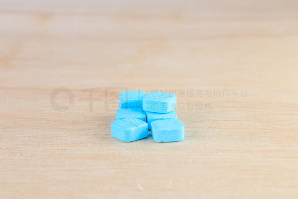 pills blue On wooden floor with copy space add text