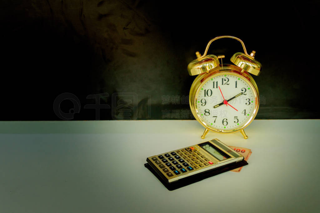 calculator and alarm clock old vintage gold over white