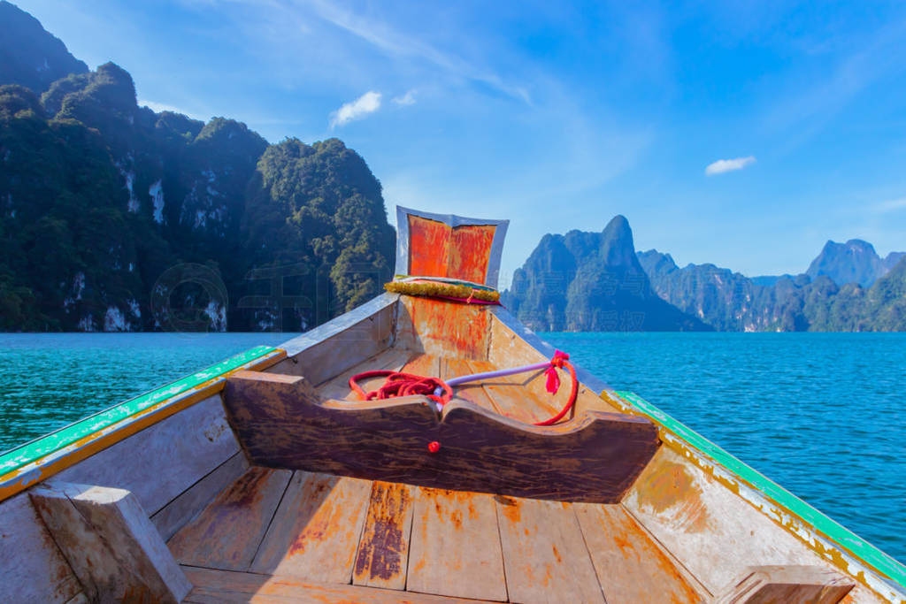 Wooden boat on sailing travel in Ratchaprapa Dam