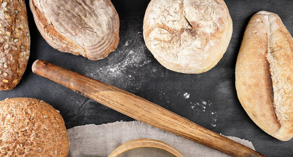 baked various loaves of bread and old rolling pin