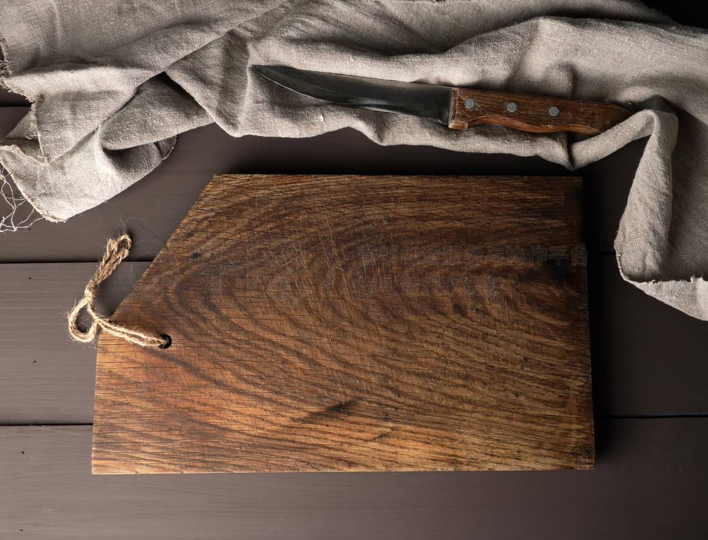 old wooden kitchen chopping boards and a gray towel