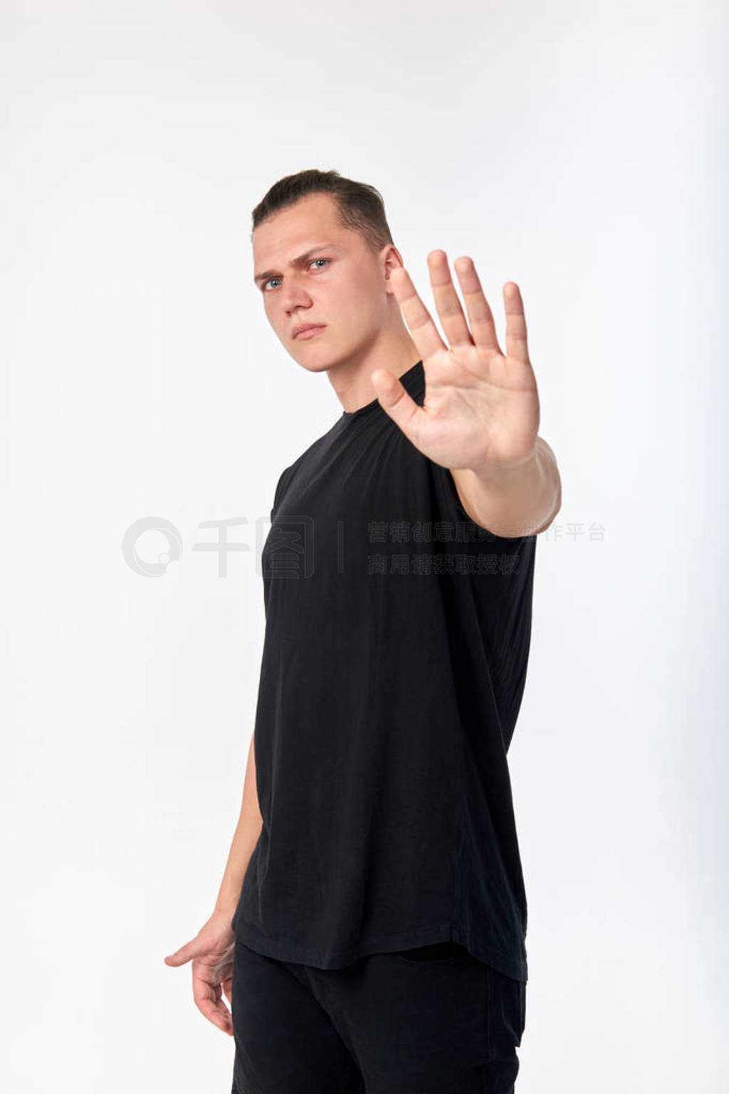 Body language. Young unhappy man showing a gesture of denial or