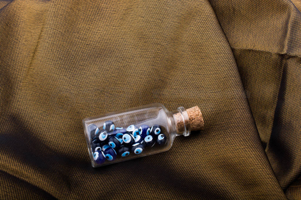 Evil eye bead in bottle as souvenir