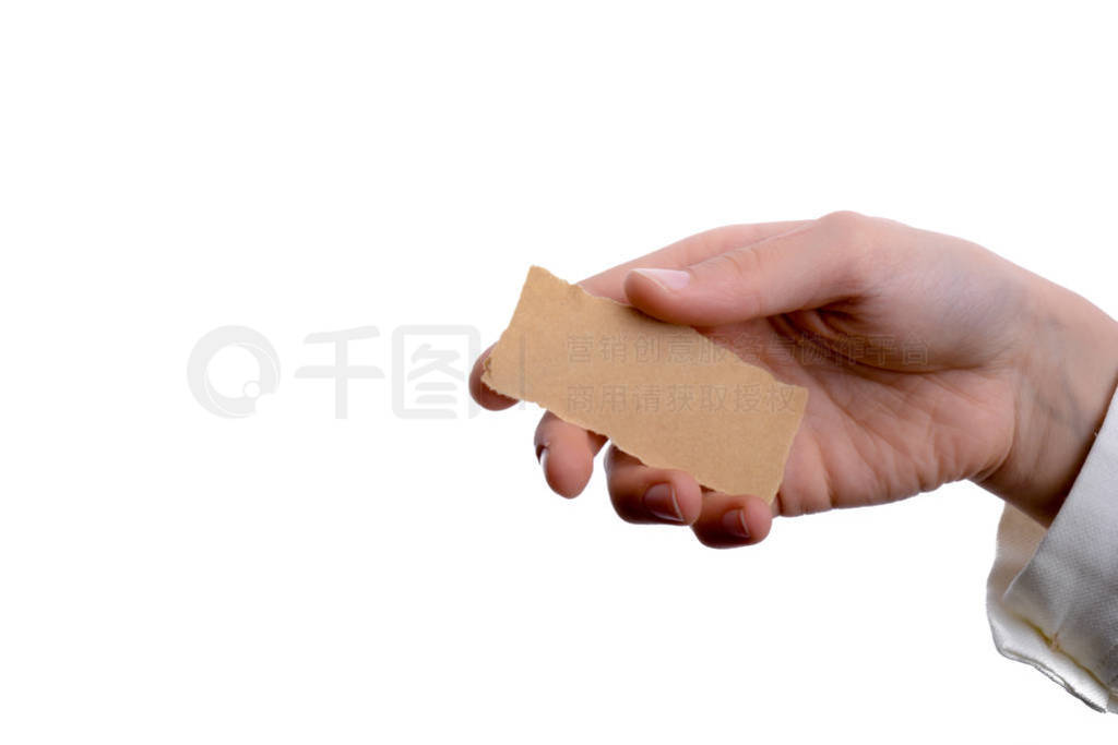 blank torn notepaper in hand