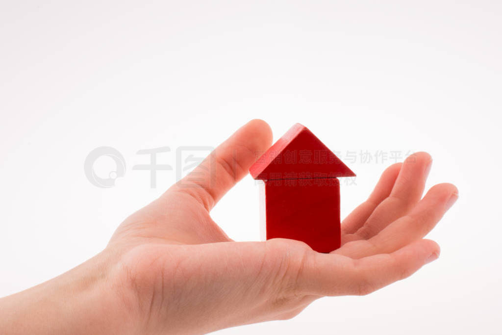 house with cubes in hand