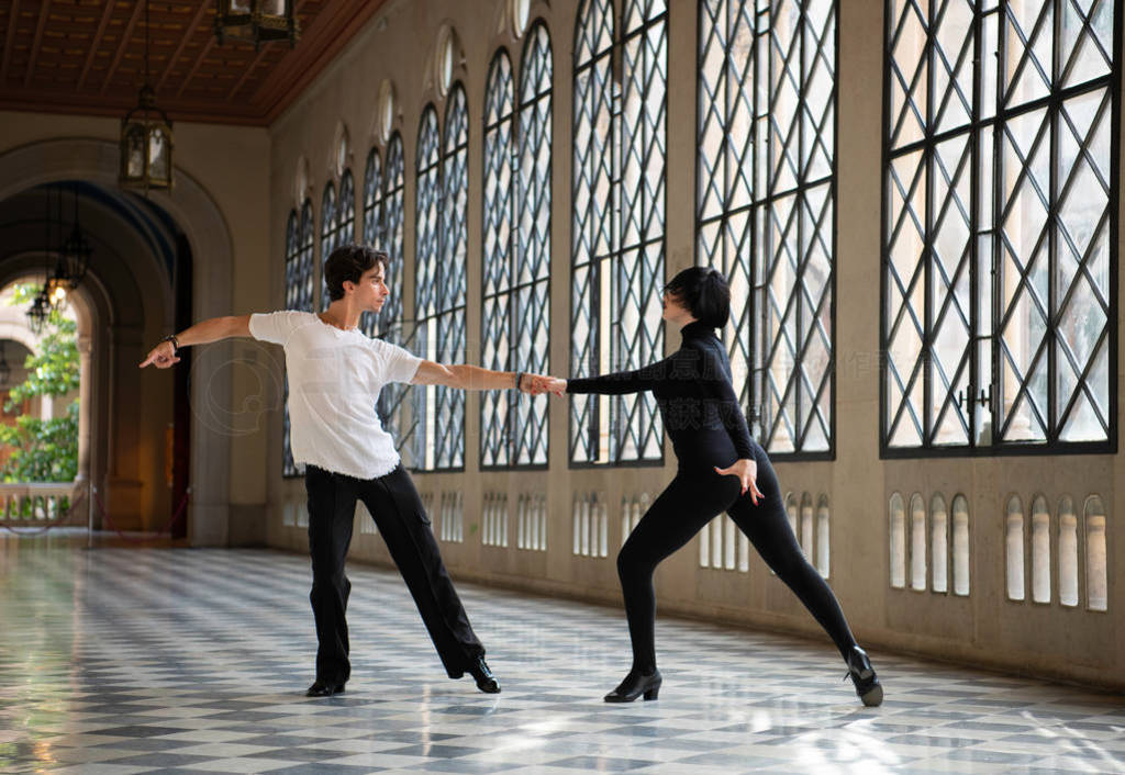 Professional ballroom dancers dancing passionately while practic