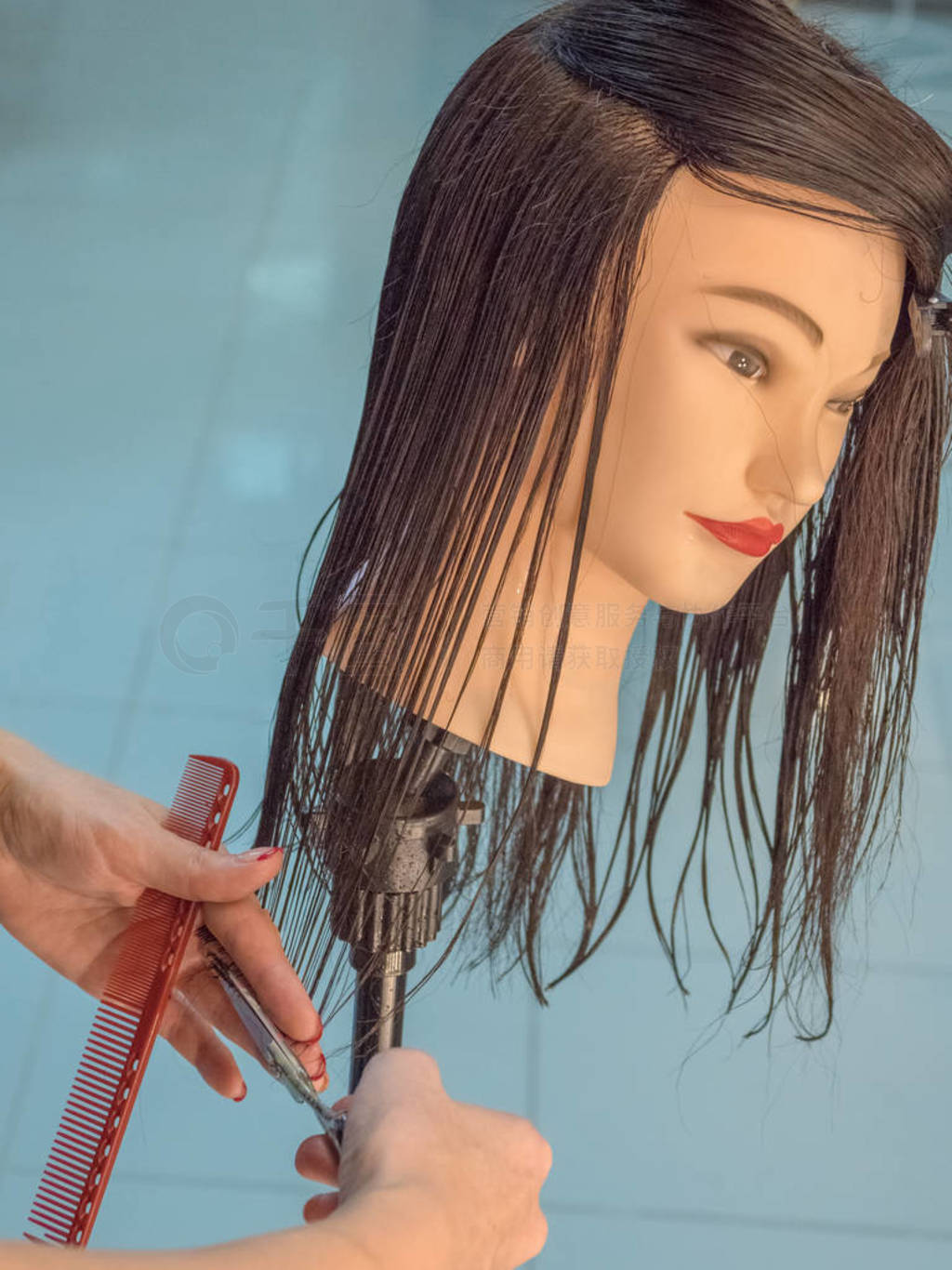 Training hairdresser with mannequins.