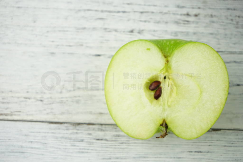 Red and green apples on wooden background texture. Healthy Food