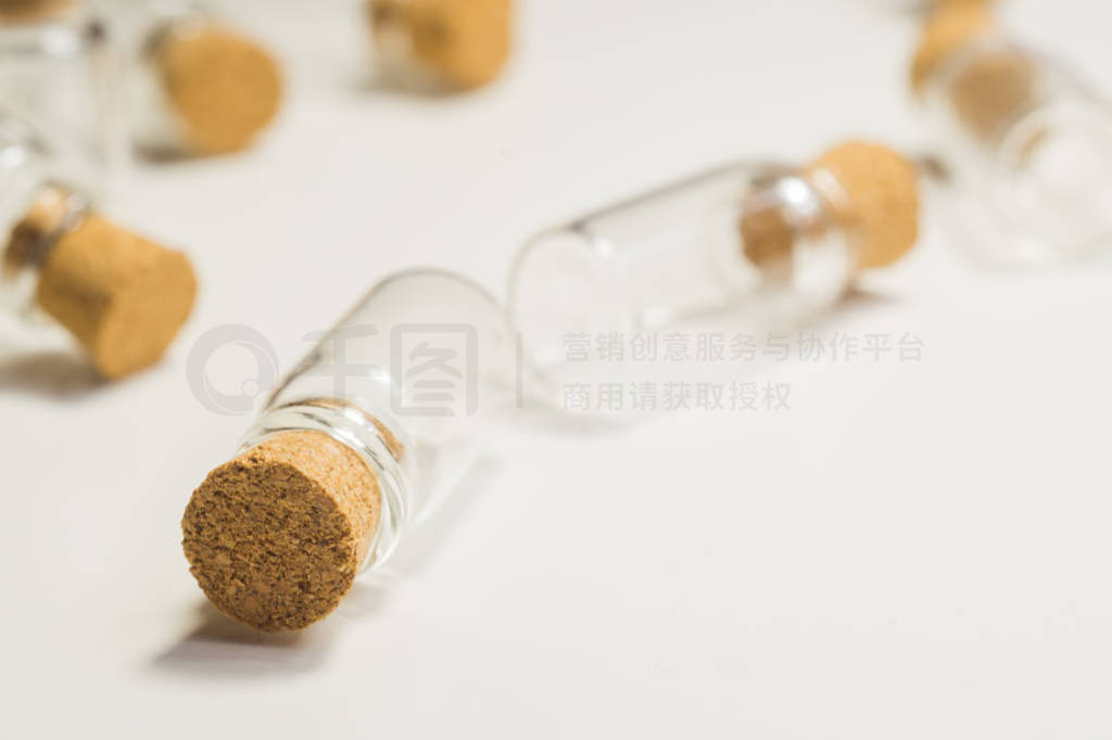 Empty little bottles with cork stopper isolated on white. transp