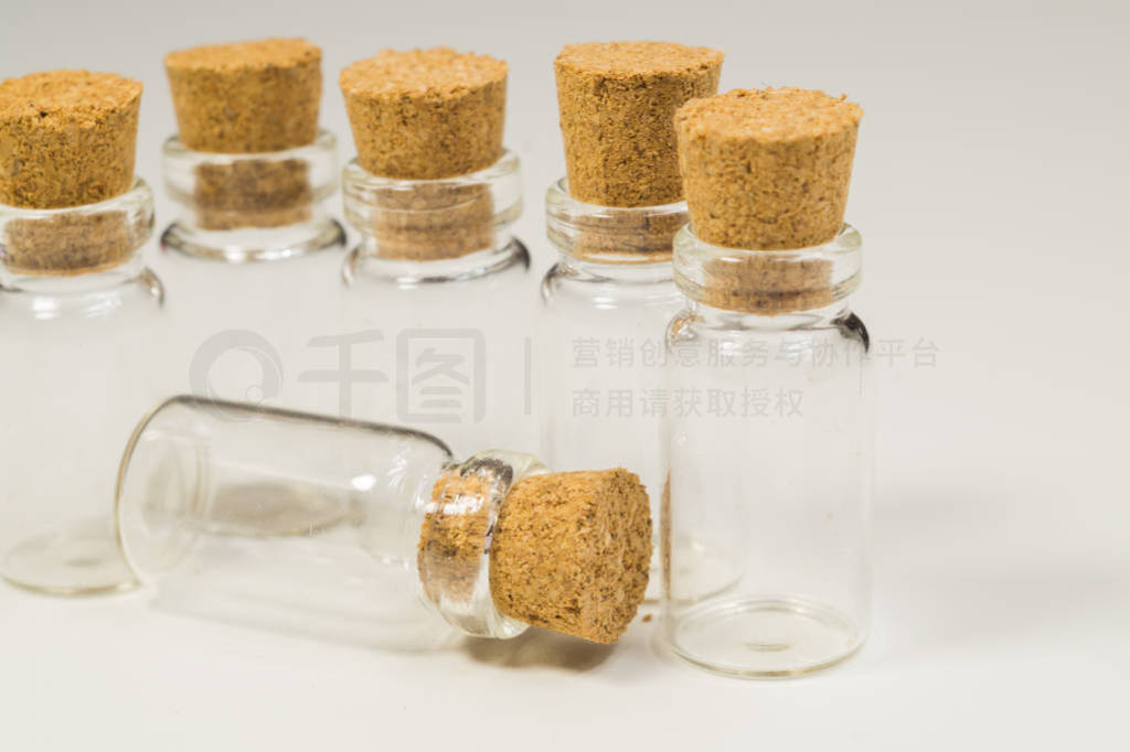 Empty little bottles with cork stopper isolated on white. transp