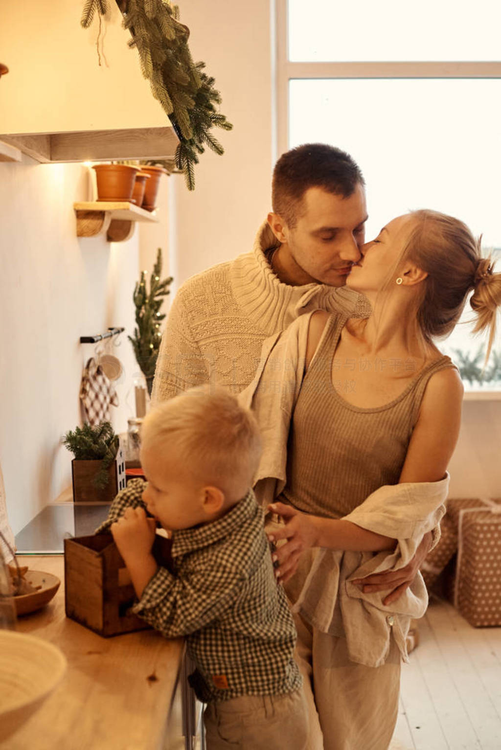 a young family dad, mom and their little son have a fun playing