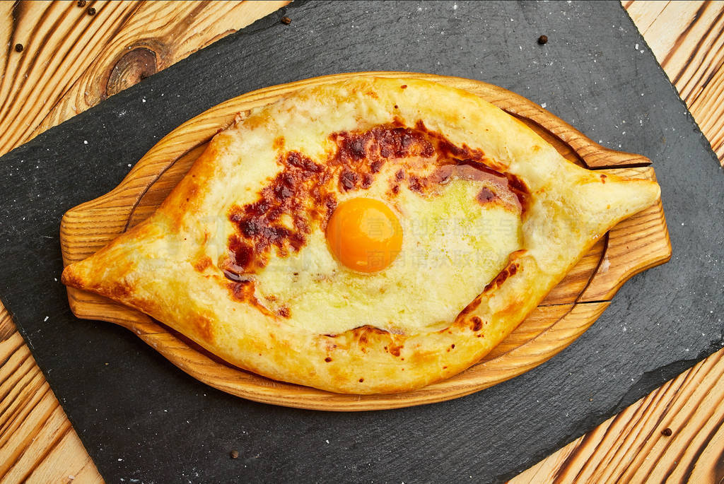 Ajarian Khachapuri traditional Georgian cheese pastry with eggs