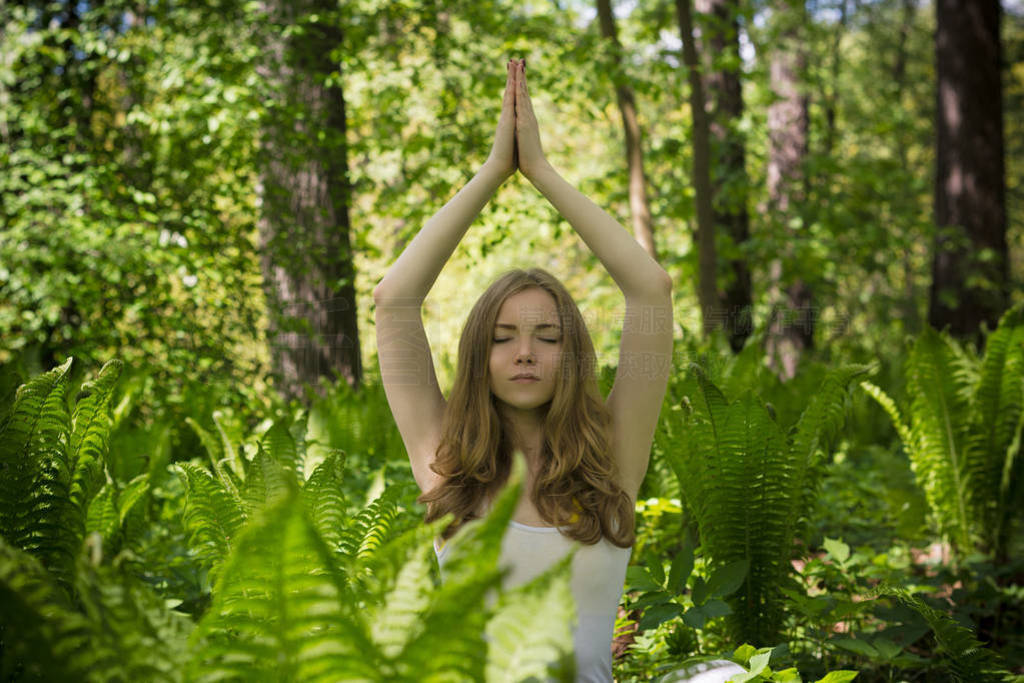 The girl is doing yoga.