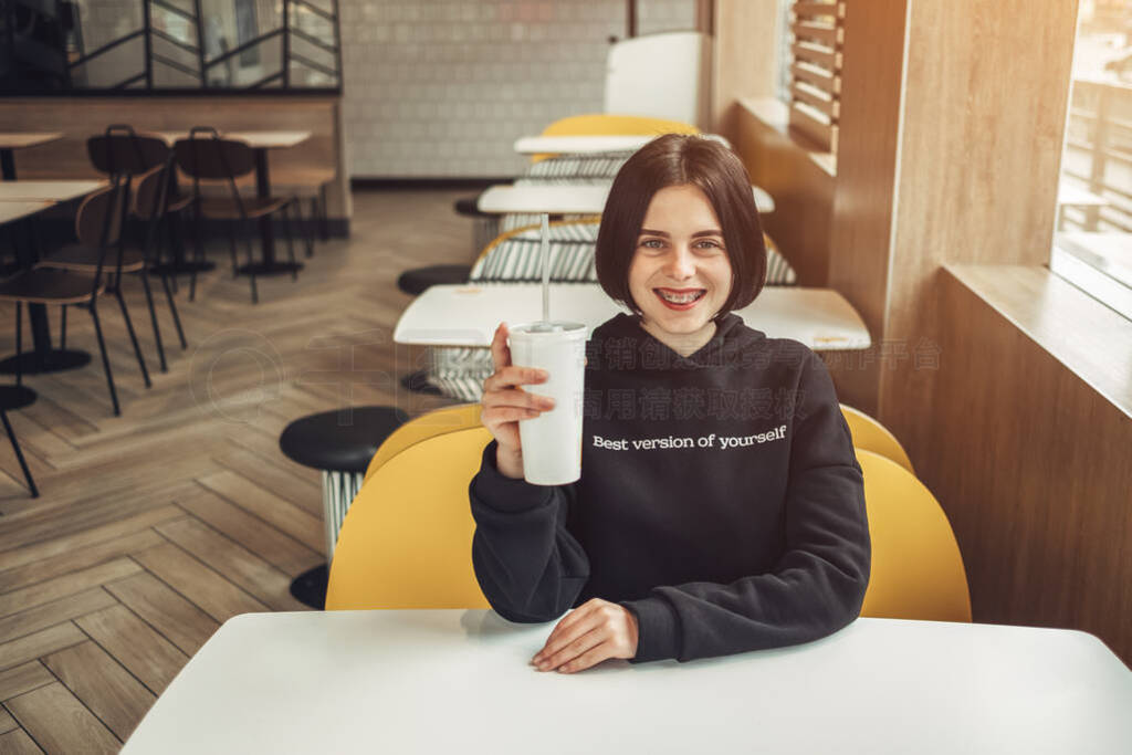 Beautiful Brunette Girl in Black Pullover with Text ''Best Versi