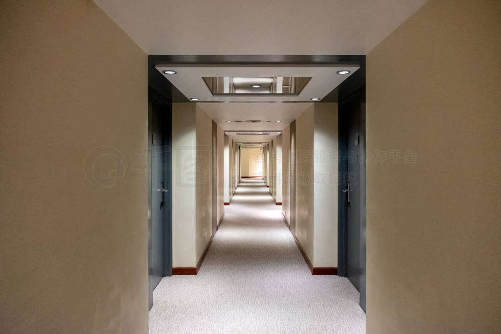 Empty corridor with closed rows door with lighting decoration