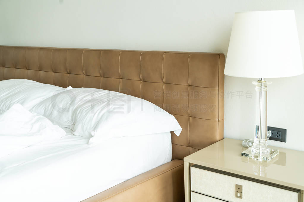 Messy bed with white pillow and blanket on bed