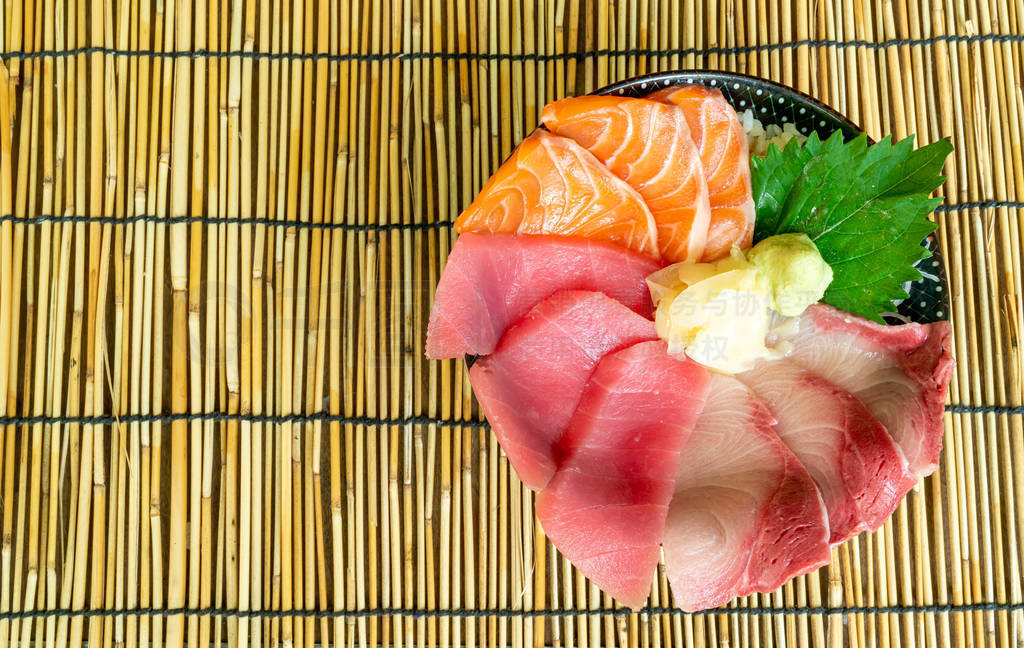 fresh salmon tuna and hamachi raw on topped rice -Japanese food