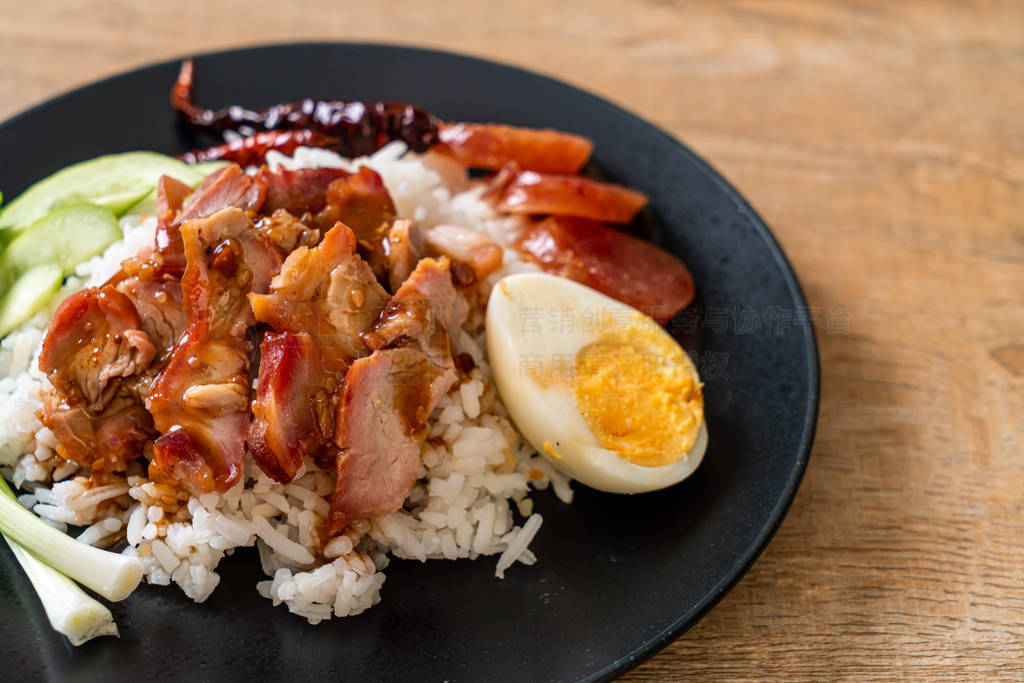 Barbecued red pork in sauce on topped rice
