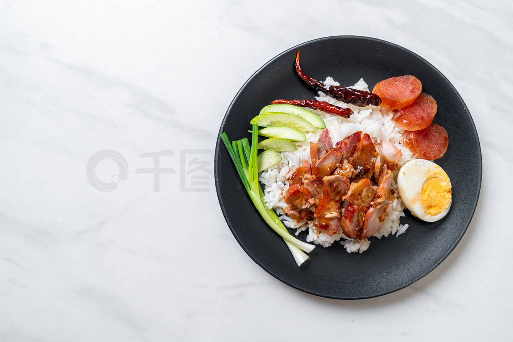 Barbecued red pork in sauce on topped rice