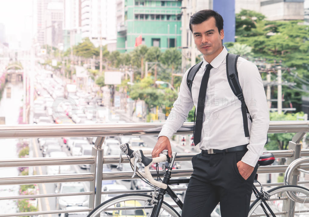 Modern Business man is cycling bicycle to work to avoid traffic