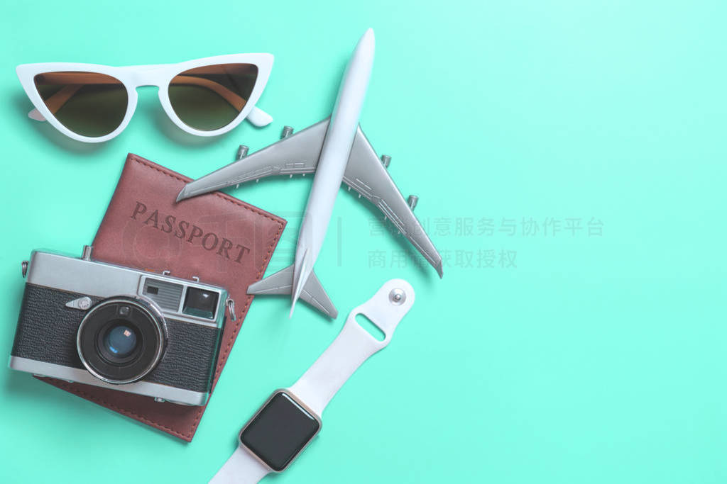 Travel accessories objects and gadgets top view flatlay on blue