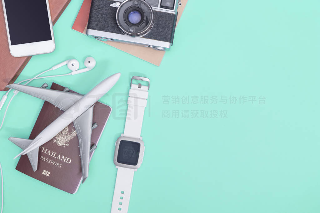 Travel accessories objects and gadgets top view flatlay on blue