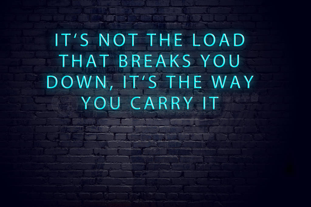Positive inspiring quote on neon sign against brick wall