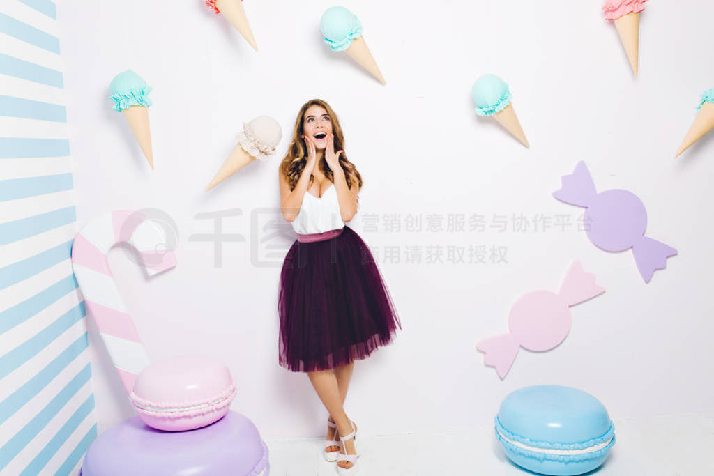 Happy time of joyful young woman in tulle skirt isolated on whi