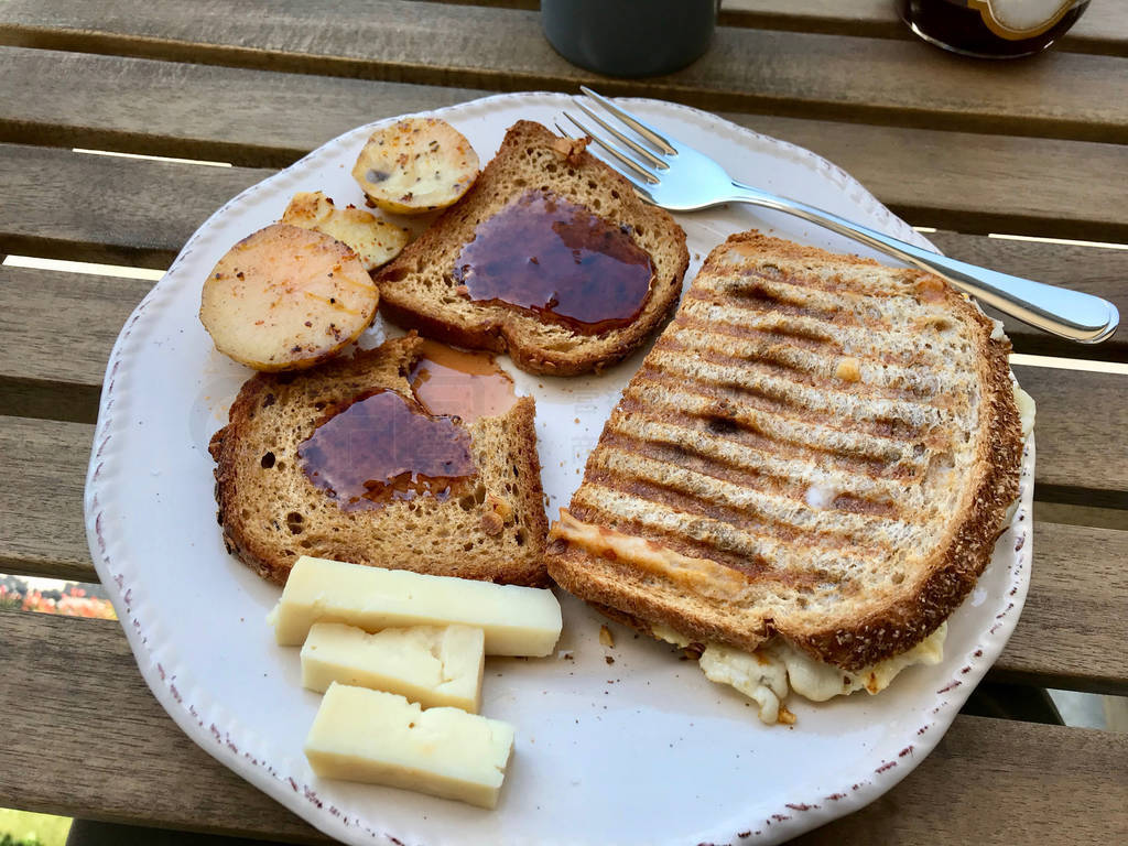 Breakfast with Toast Bread Sandwich with Jam, Fried Egg and Melt