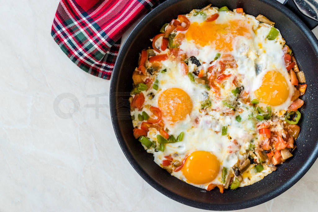 Fried Eggs with Vegetables in Pan Cooking