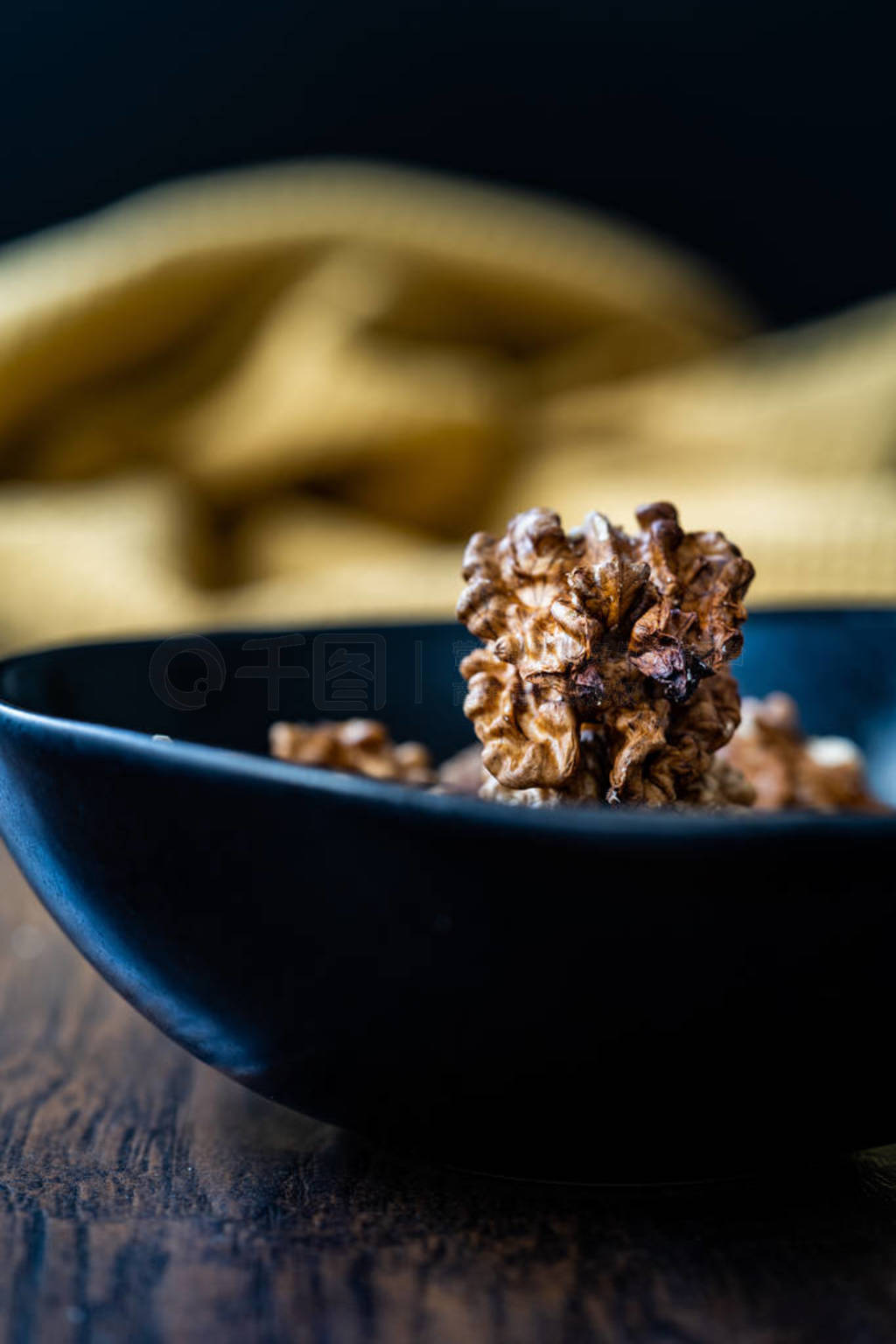 Walnut Kernels and Whole walnuts in Porcelain Bowl.