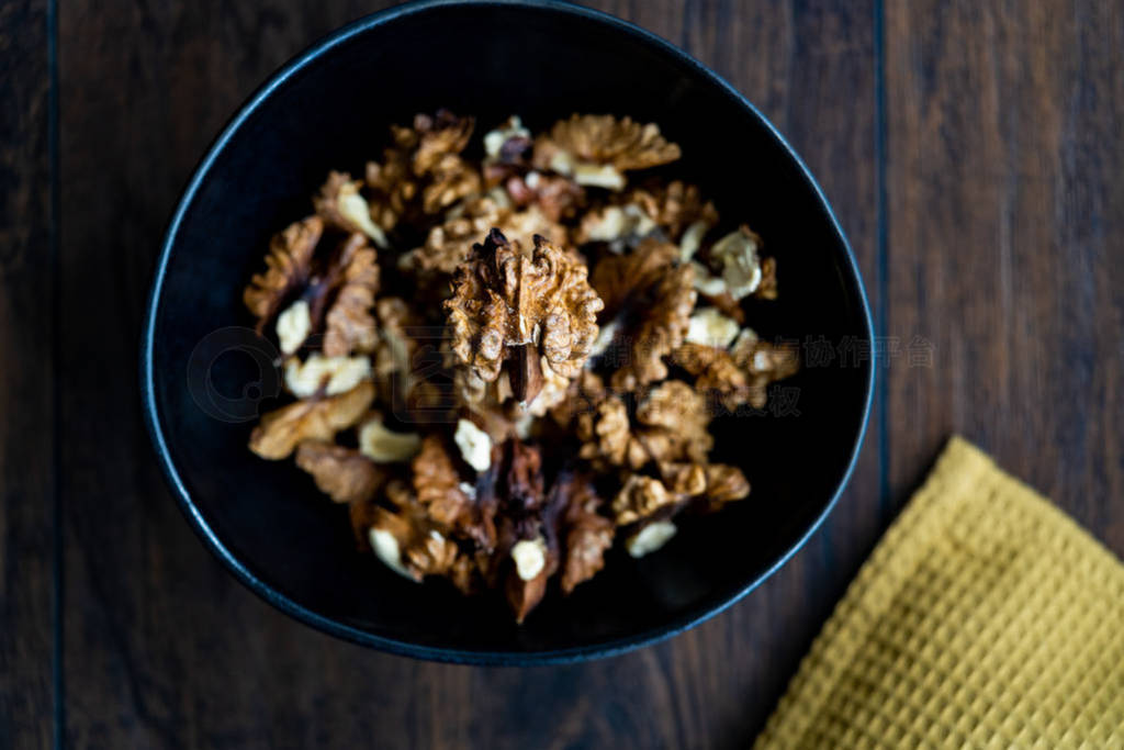 Walnut Kernels and Whole walnuts in Porcelain Bowl.