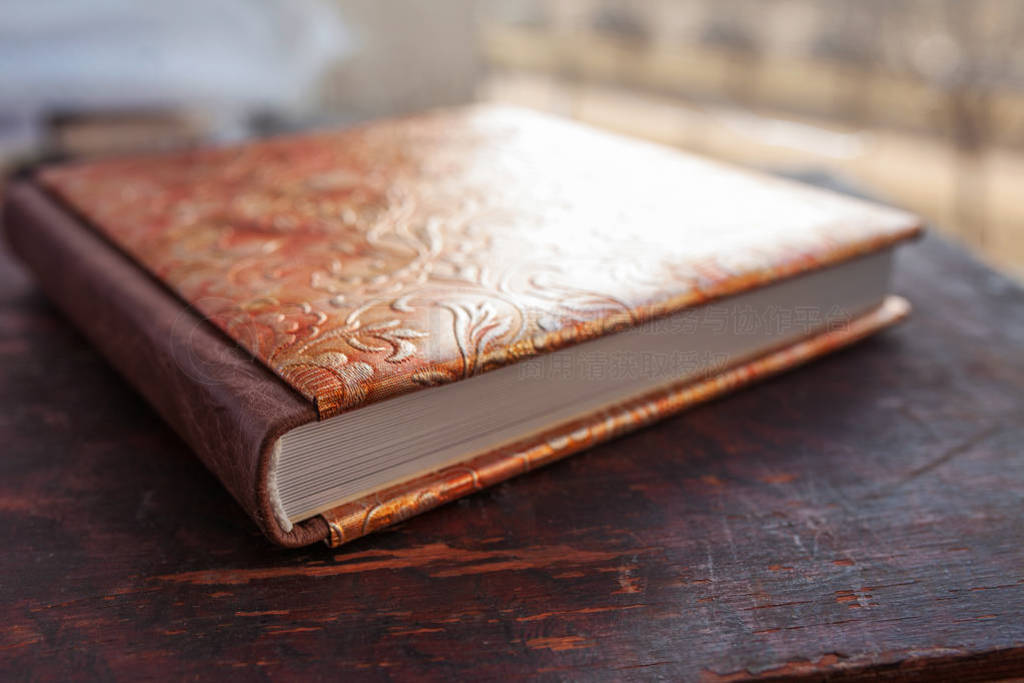 Photobook with a cover of genuine leather. Beautiful cover with
