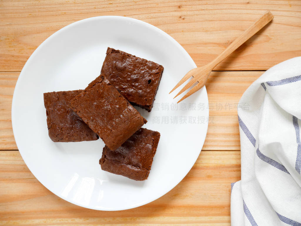 Homemade chocolate brownies on a white plate