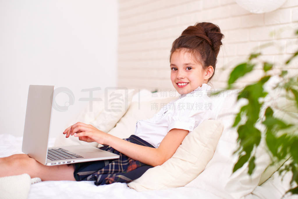 the child is happy to communicate with friends via the Internet