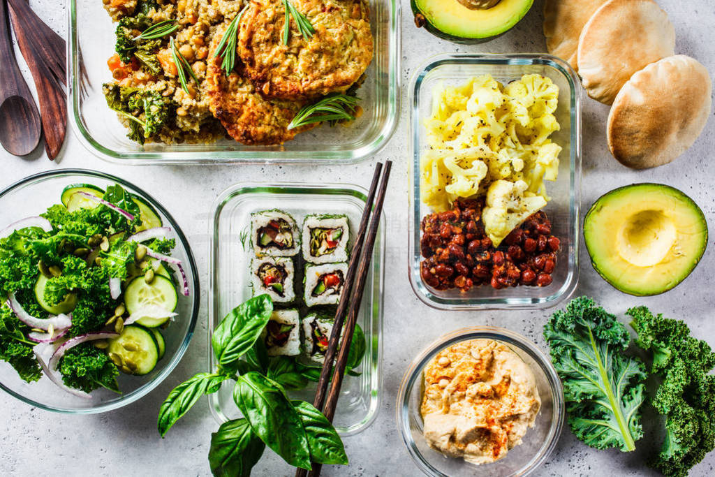 Healthy vegan food in glass containers.
