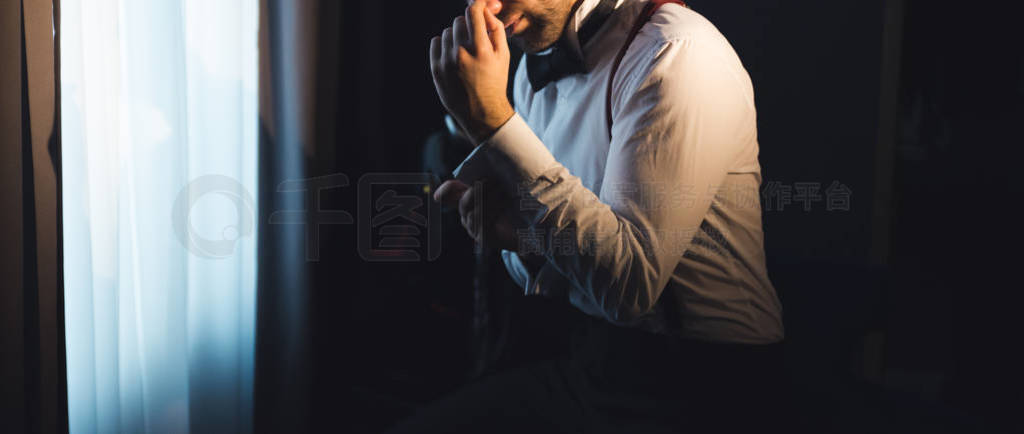 Elegant young handsome man wearing suit at studio fashion portra