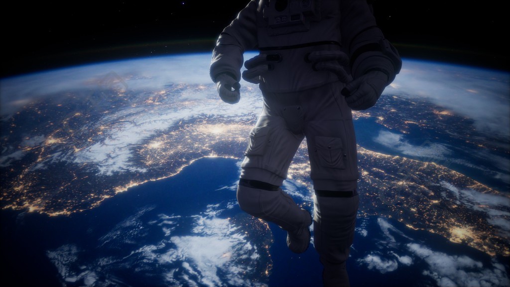 在太空中的宇航员在行星地球的背景下这幅图像由美国国家航空航天局