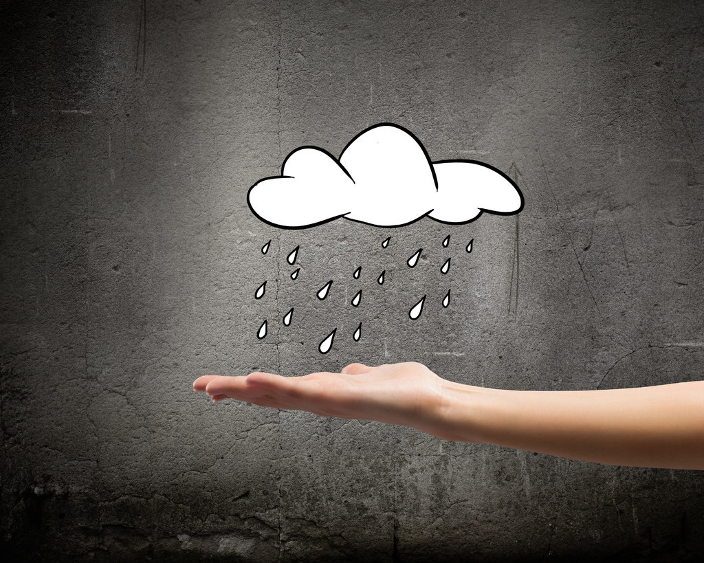 下雨的天气与手中的雨云背景概念性表示图