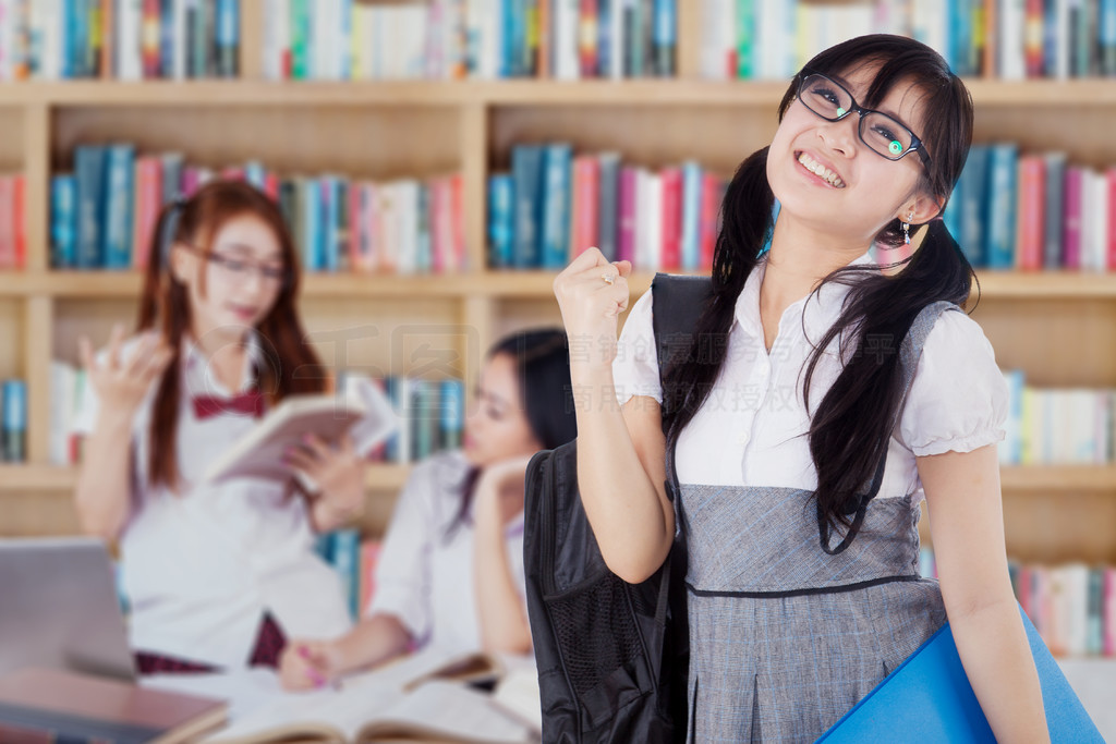 Successful student with her group in library