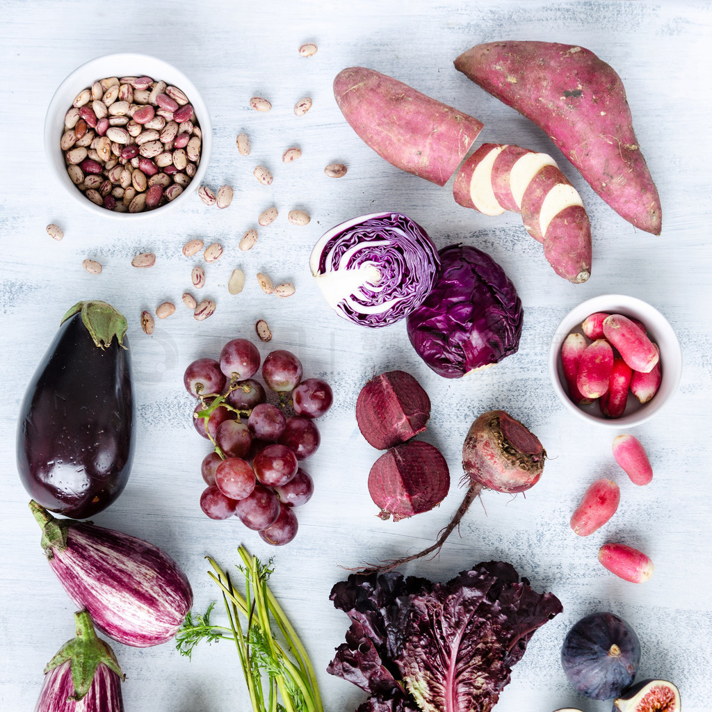 Assorted purple toned fruits and vegetables