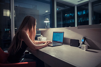 Young woman overworking in <i>the</i> office